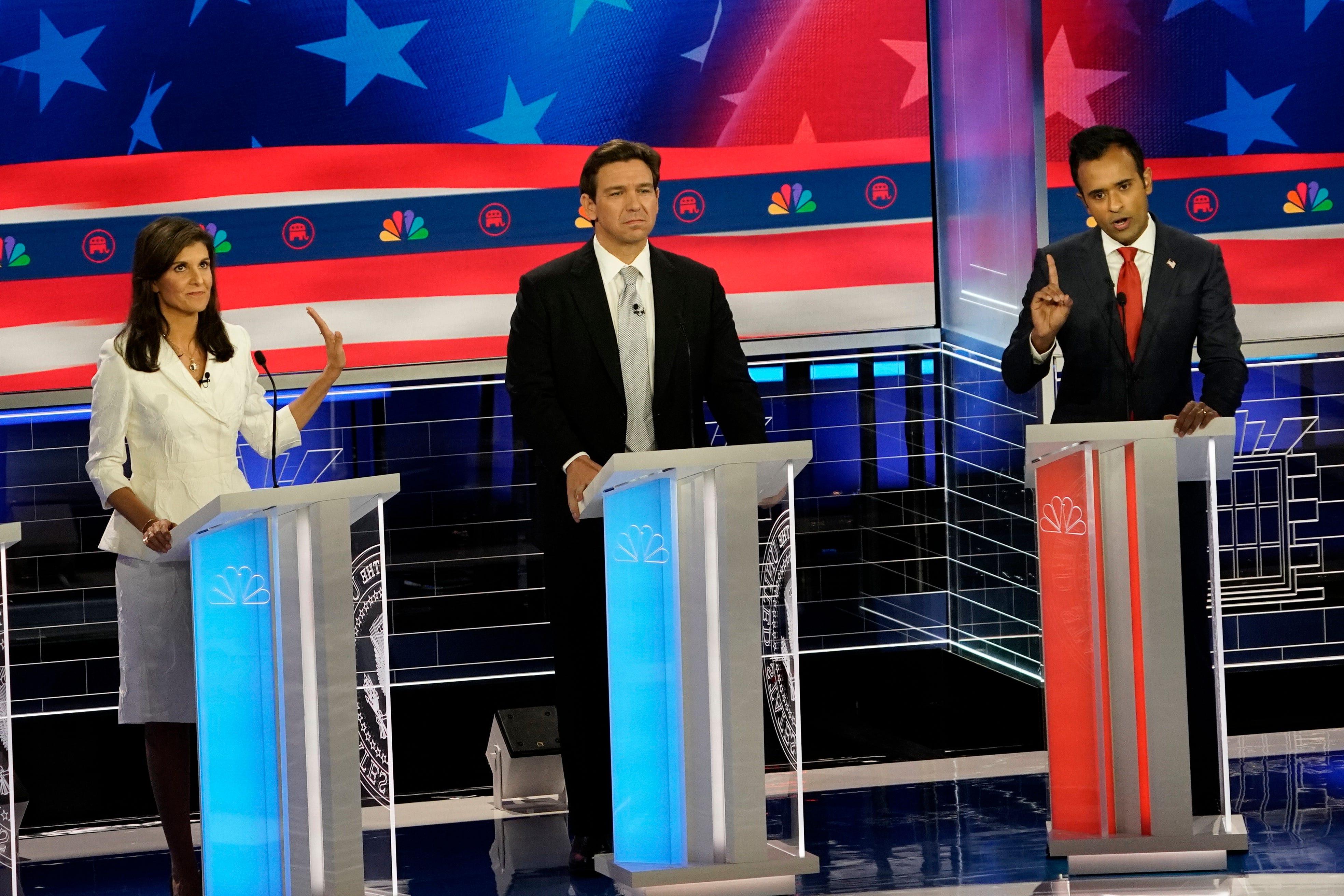 Former South Carolina Gov. Nikki Haley, Florida Gov. Ron DeSantis and businessperson Vivek Ramaswamy during the Republican National Committee presidential primary debate hosted by NBC News at Adrienne Arsht Center for the Performing Arts of Miami-Dade County.