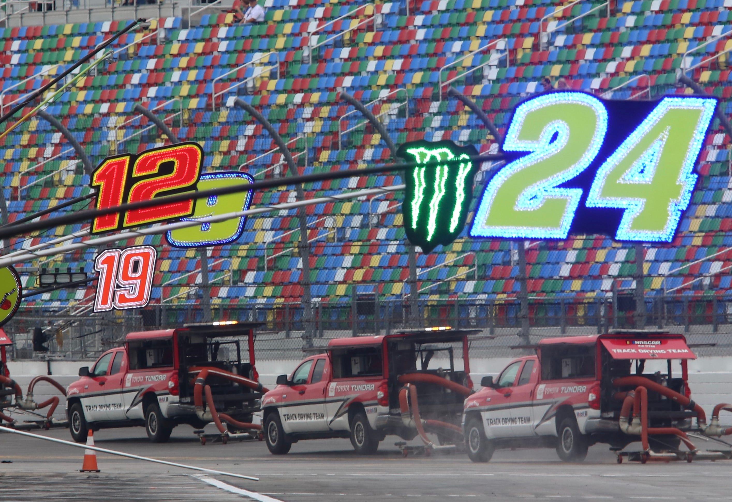 Alex Bowman (48) and Kyle Larson (5) bring the field to the green flag to start the 65th Daytona 500 on Sunday.