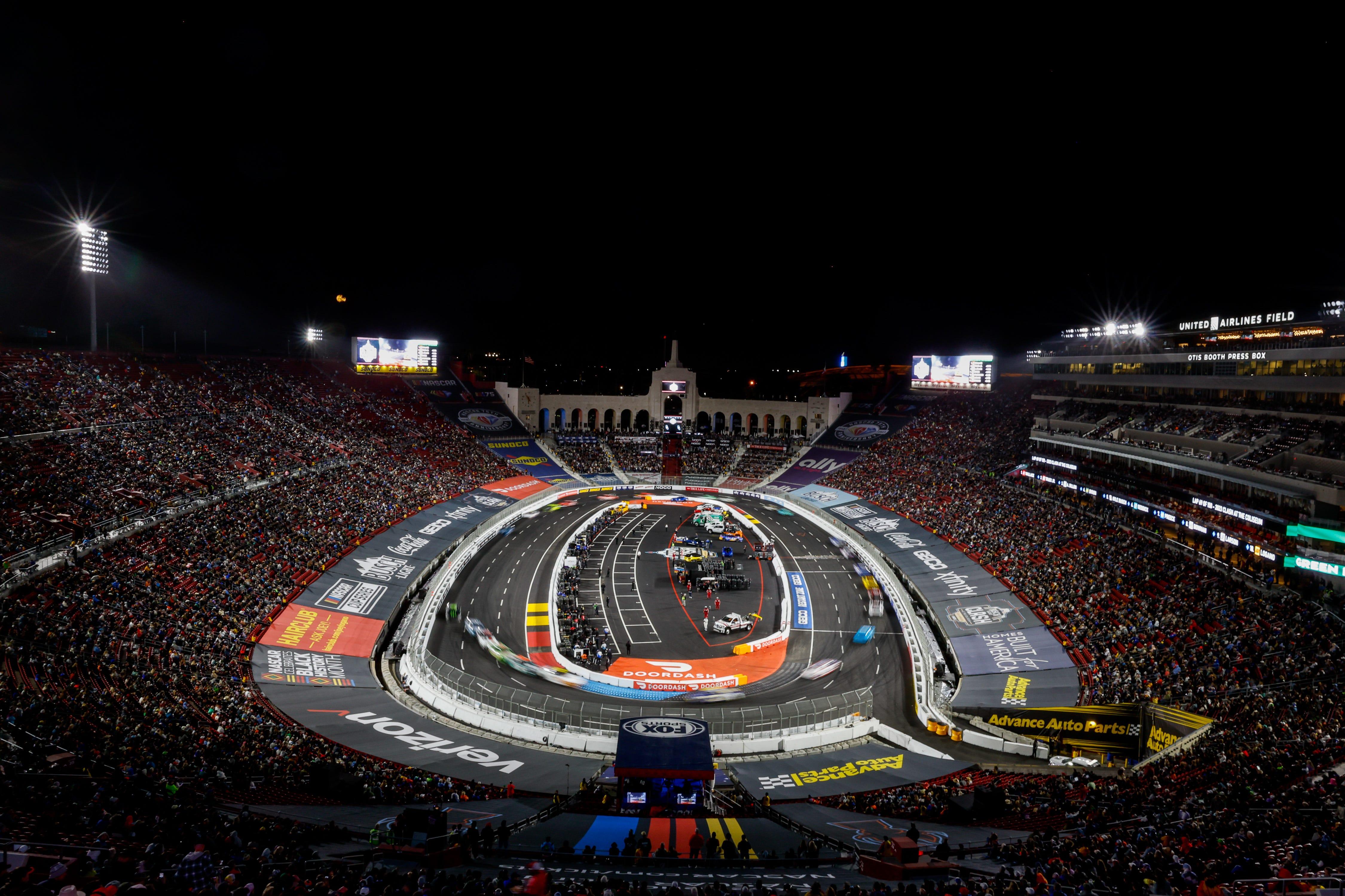 Drivers race inside the Los Angeles Memorial Coliseum during NASCAR