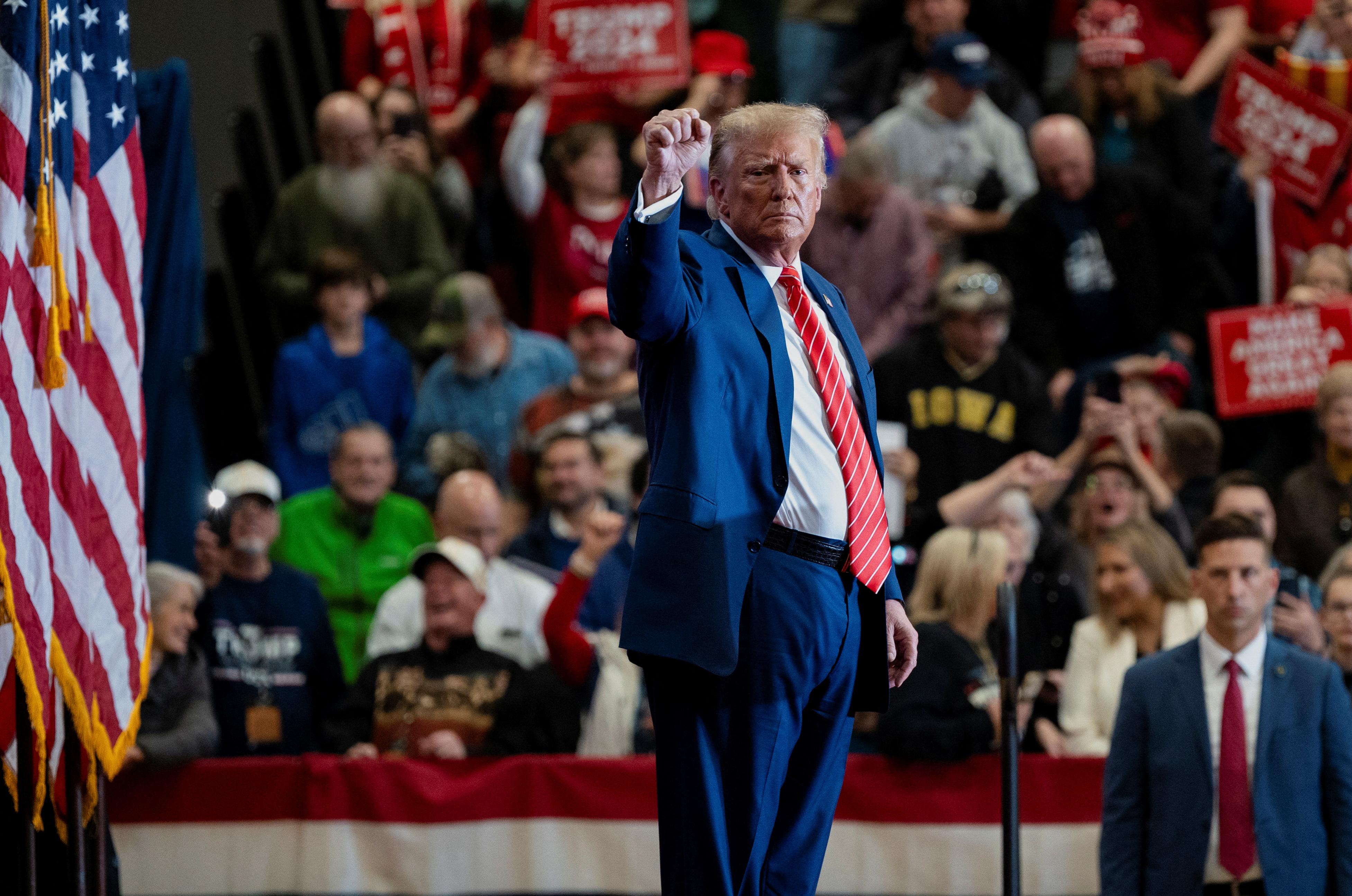 Donald Trump gestures as he attends a campaign event, in Clinton, Iowa