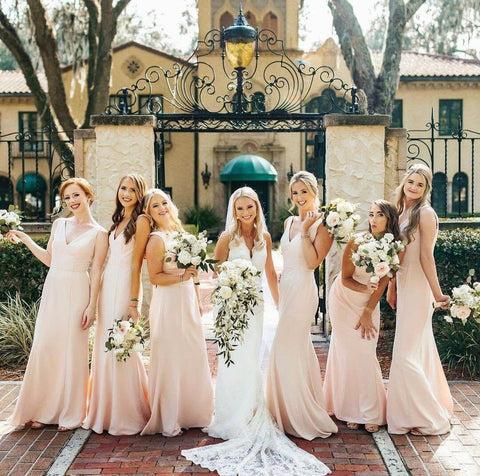 Bridesmaids in light pink dresses