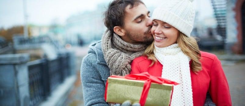 man giving woman gift on valentines day