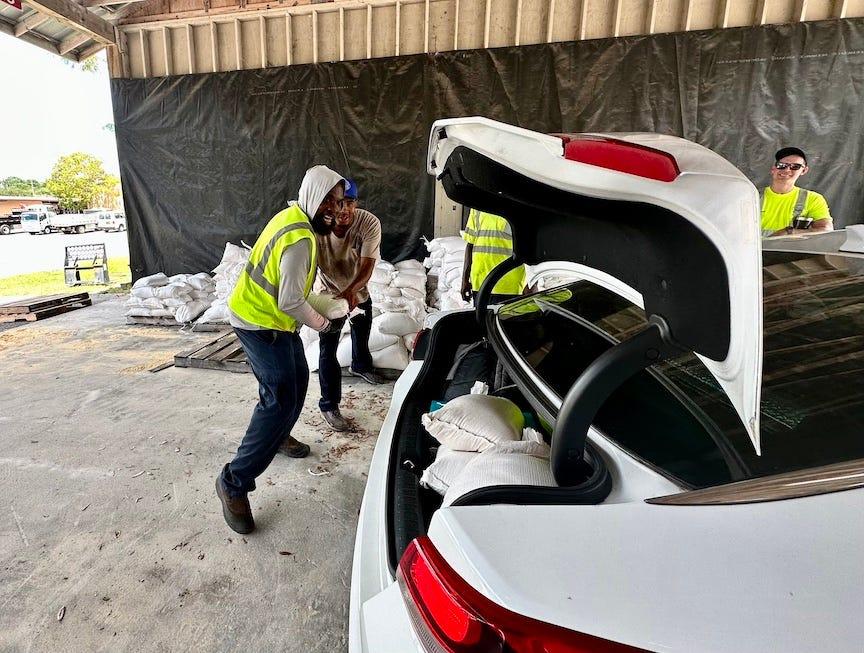 Employees with Gainesville Public Works, 405 NW 39th Ave., load sandbags for residents on Monday afternoon ahead of the arrival of Hurricane Idalia. Sandbags will be available again Tuesday from 9 a.m. to 3 p.m.