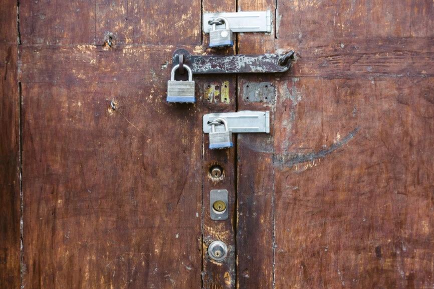 door with multiple padlocks