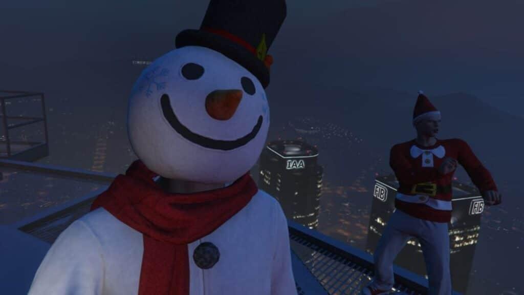 The player taking a selfie with a friend wearing the Snowman Outfit on top of the Maze Bank Tower.