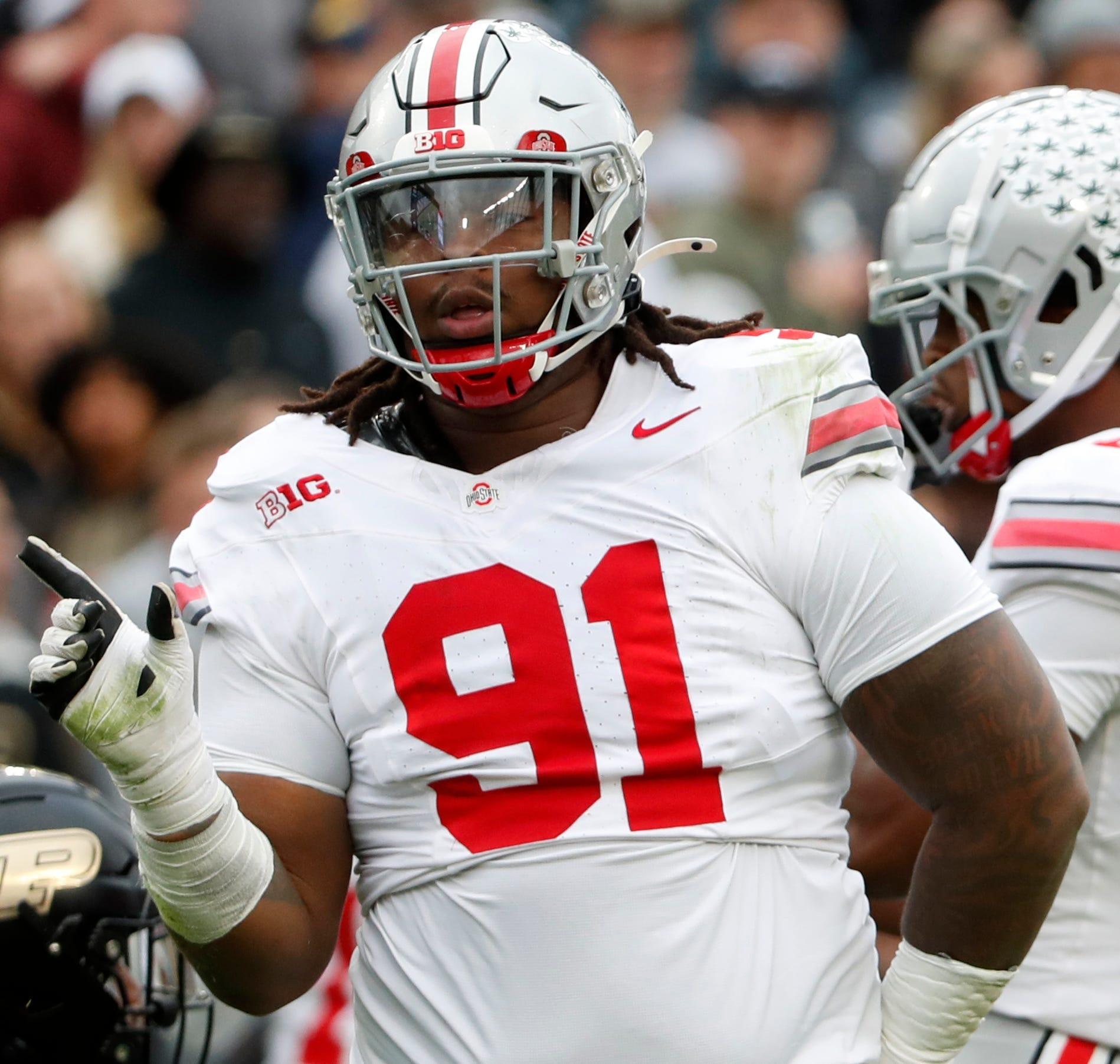 Ohio State Buckeyes defensive tackle Tyleik Williams (91) reacts after a defensive stop during the NCAA football game against the Purdue Boilermakers, Saturday, Oct. 14, 2023, at Ross-Ade Stadium in West Lafayette, Ind. Ohio State Buckeyes won 41-7.