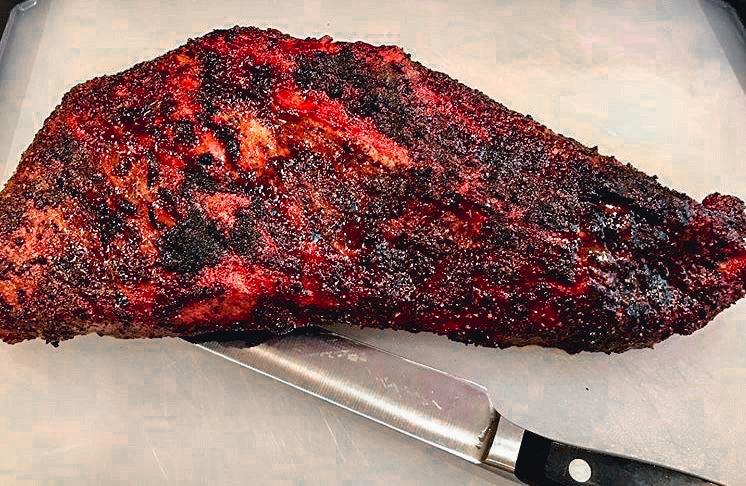 Photo of cooked tri-tip steak on a cutting board