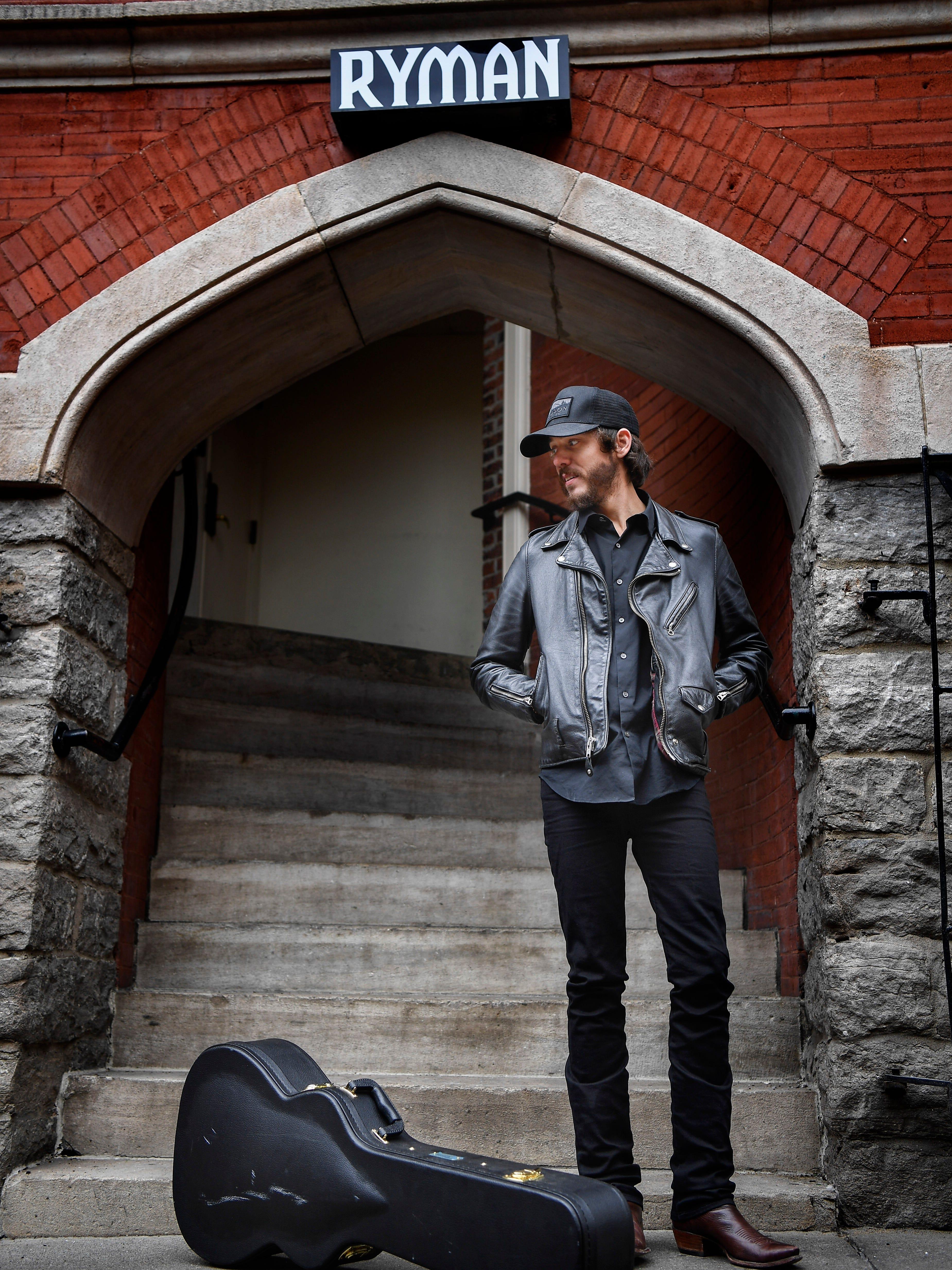 American singer songwriter Chris Janson stands in the alley between Tootsie