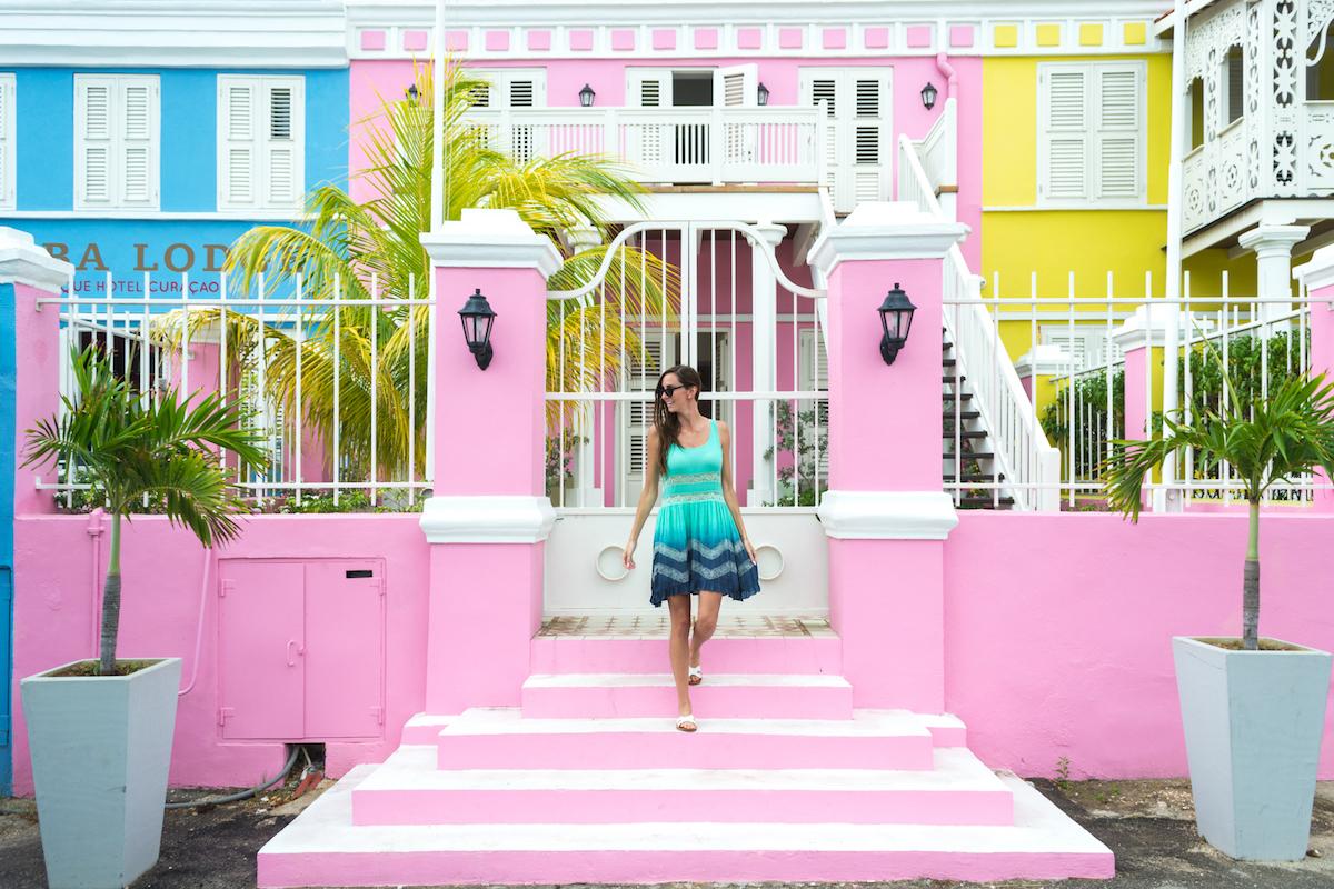 There are many colorful buildings in Willemstad, Curacao like these blue, pink and yellow colonial houses.