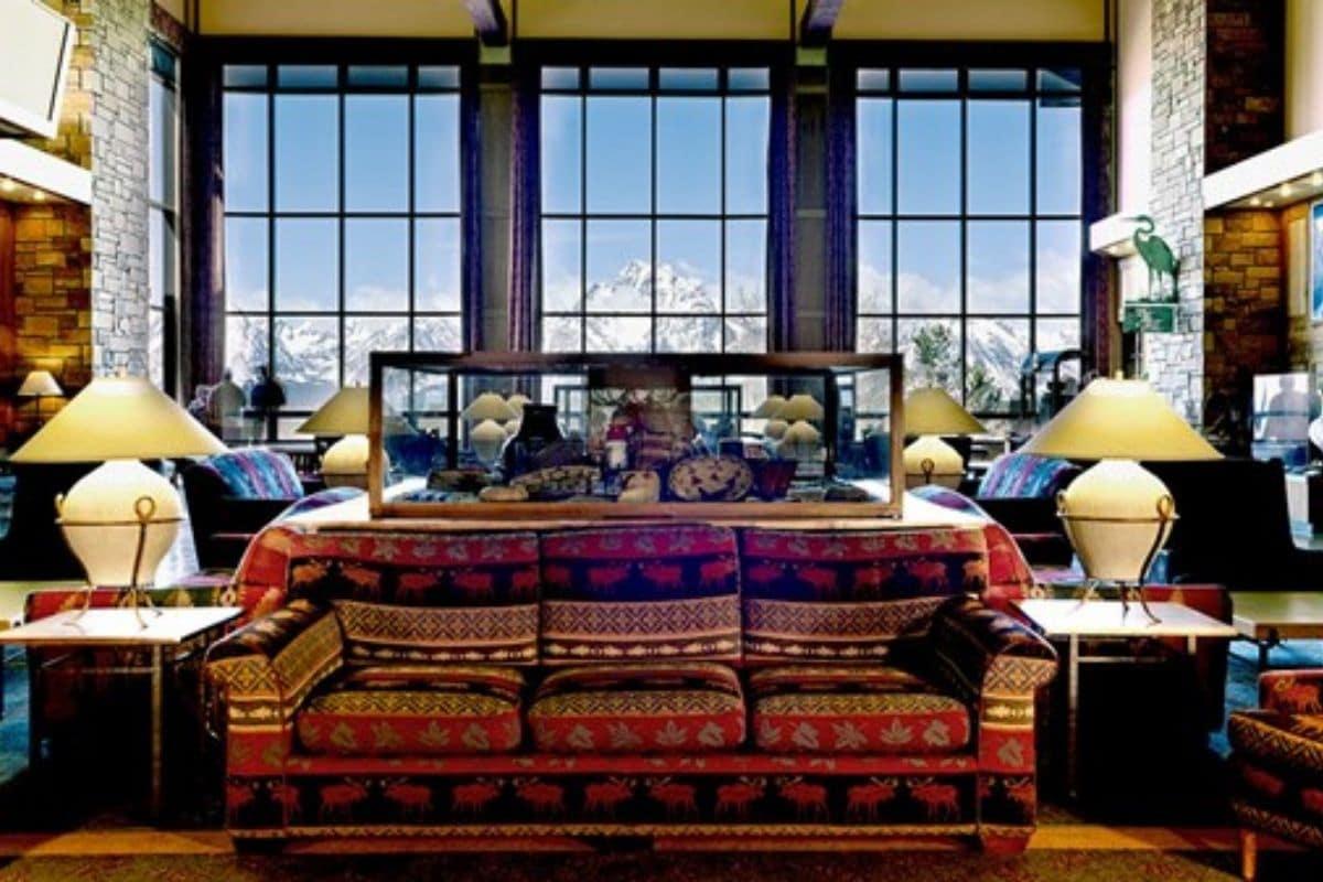 Sofa in front of large windows with a view of the Tetons in Jackson Lake Lodge in Grand Teton