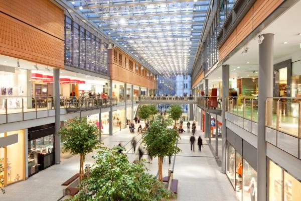 interior of a shopping mall with people walking inside