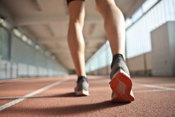 Person walking on an indoor walking track