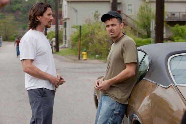 This image released by Relativity Media shows Christian Bale, left, and Casey Affleck in a scene from "Out of the Furnace." (AP Photo/Relativity Media, Kerry Hayes)