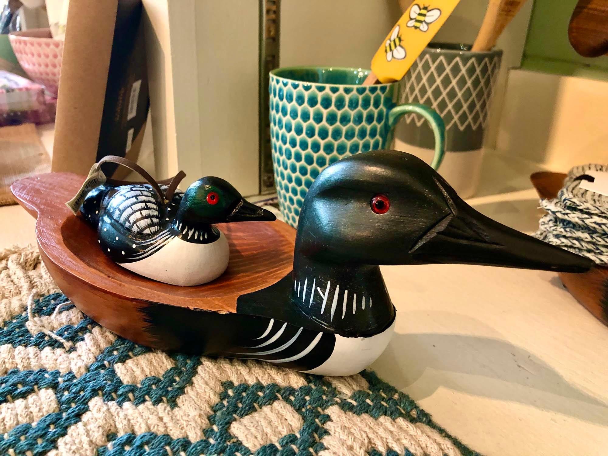The Squam Lake Marketplace has gifts. The Common Loon is a spectacular looking water bird with black and white feathering and piercing red eyes.