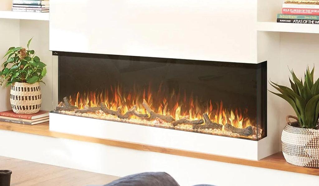 Large linear electric fireplace with three viewing sides for the flames installed in a white wall.
