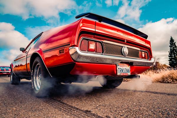 Red Mach 1 Mustang with loud mufflers
