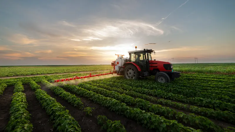 Tractor spraying soybean field-MFWD