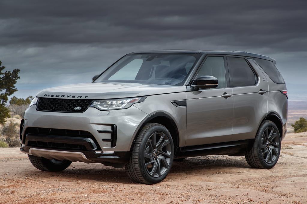 a grey land rover discovery parked on sand