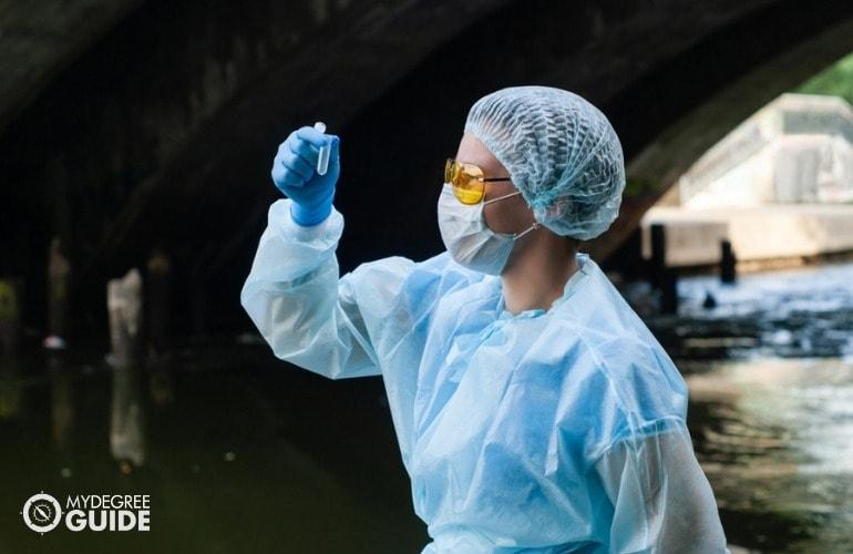 epidemiologist taking water samples