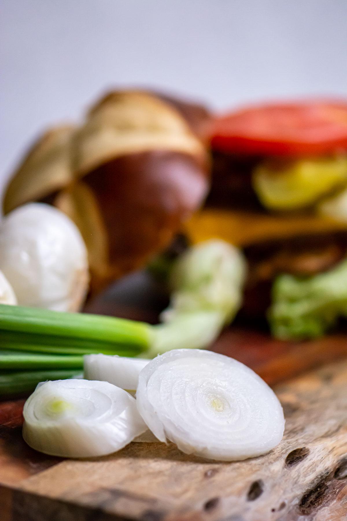 spring onions sliced on a cutting board.