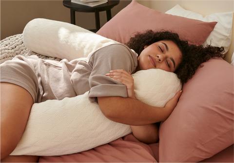 women sleeping with bearaby cuddler