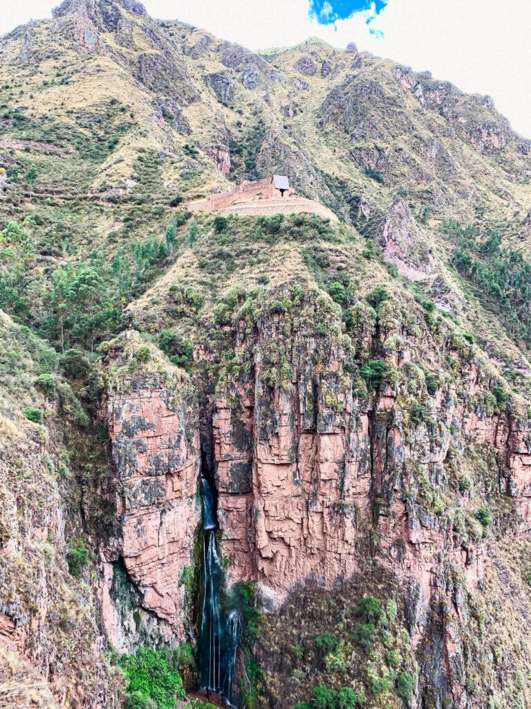 Inca ruins on top of a south america waterfall