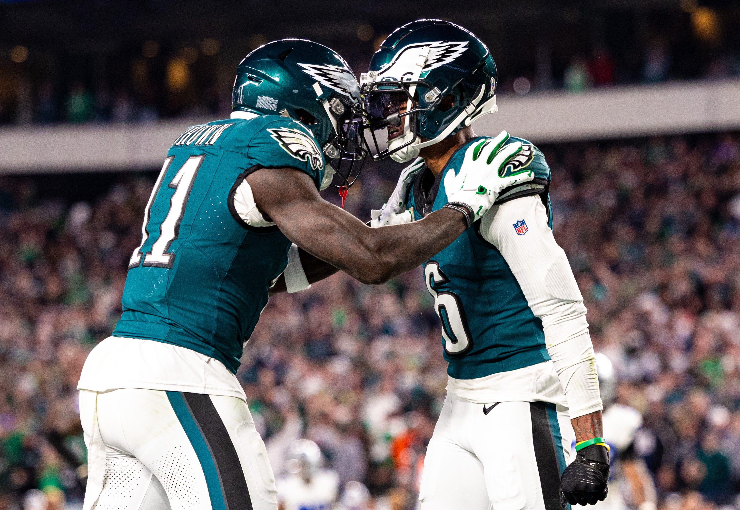 Eagles wide receivers DeVonta Smith (6) and A.J. Brown (11) celebrate after a touchdown against the Cowboys during the third quarter at Lincoln Financial Field in Philadelphia on Nov. 5, 2023.