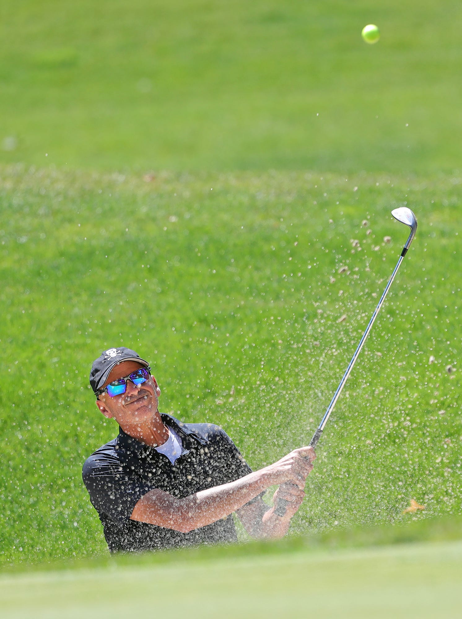 Rocco Mediate plays out of the bunker on the 6th hole during first round of the Bridgestone Senior Players Tournament at Firestone Country Club on Thursday.
