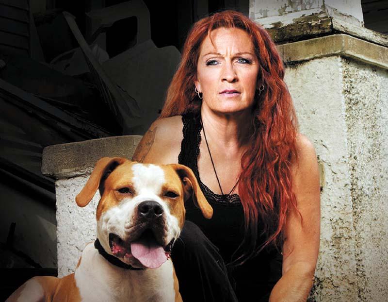 Photo of Tia Torres with her pitbull.