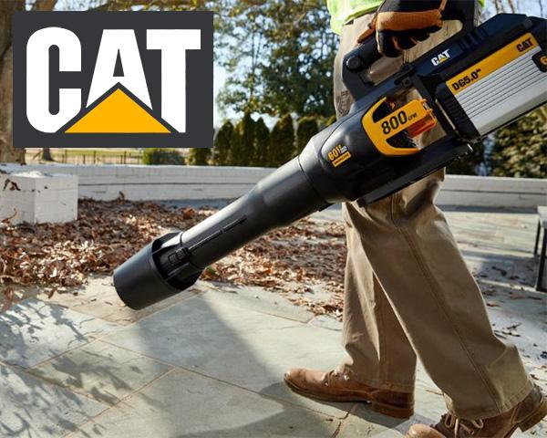 CAT 60V Cordless Blower with Battery Pushing Leaves on Sidewalk