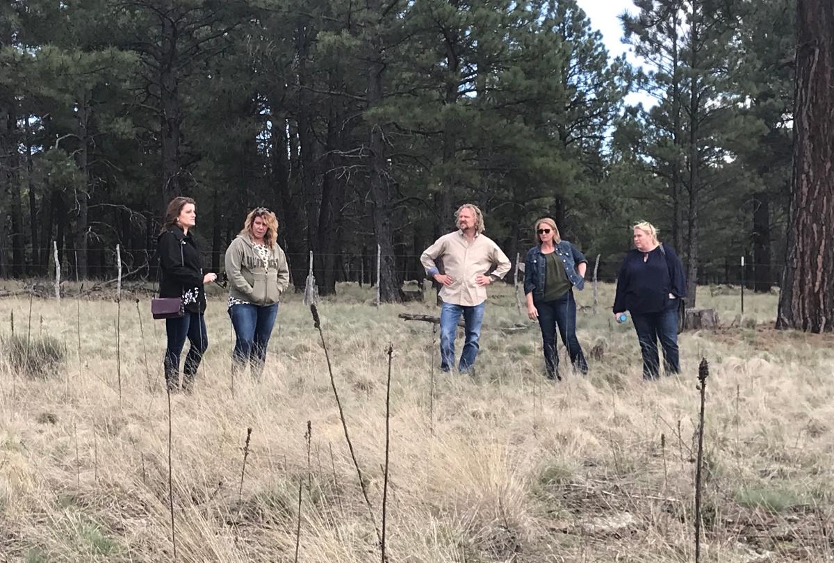 Robyn, Meri, Kody, Christine, and Janelle Brown standing together on the Coyote Pass property in Flagstaff, Arizona on