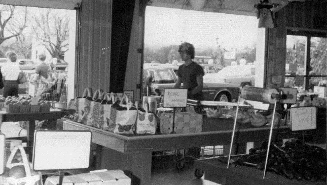 Former employee Christopher Neff works inside the market in this circa 1982 photo.