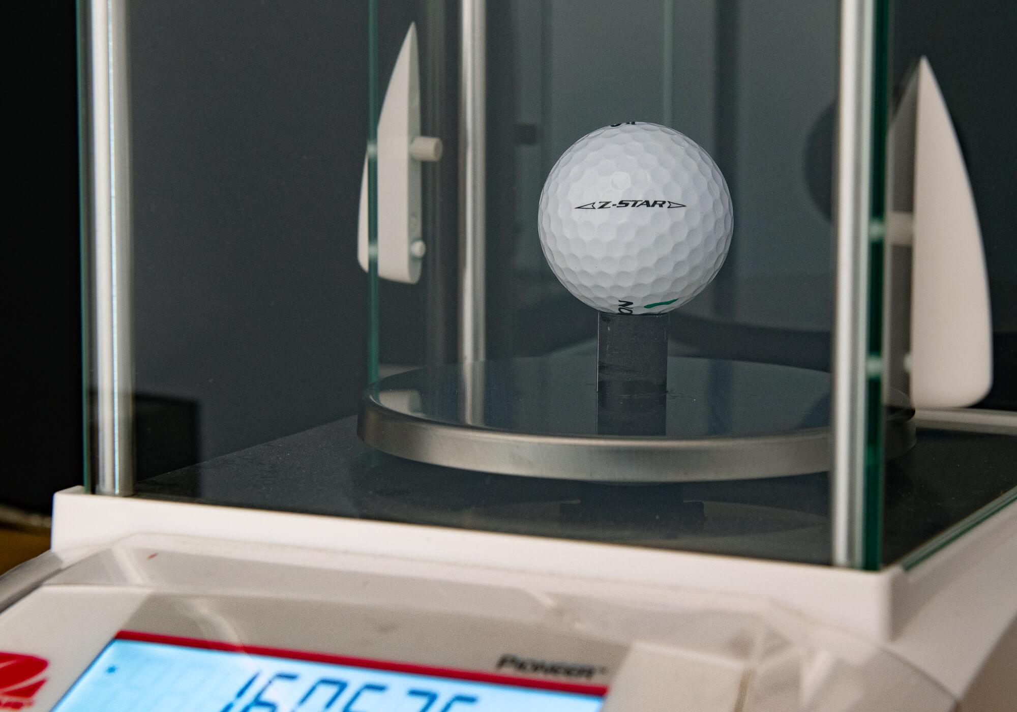 A 2023 Srixon Z-Star golf ball being weighted for Ball Lab.