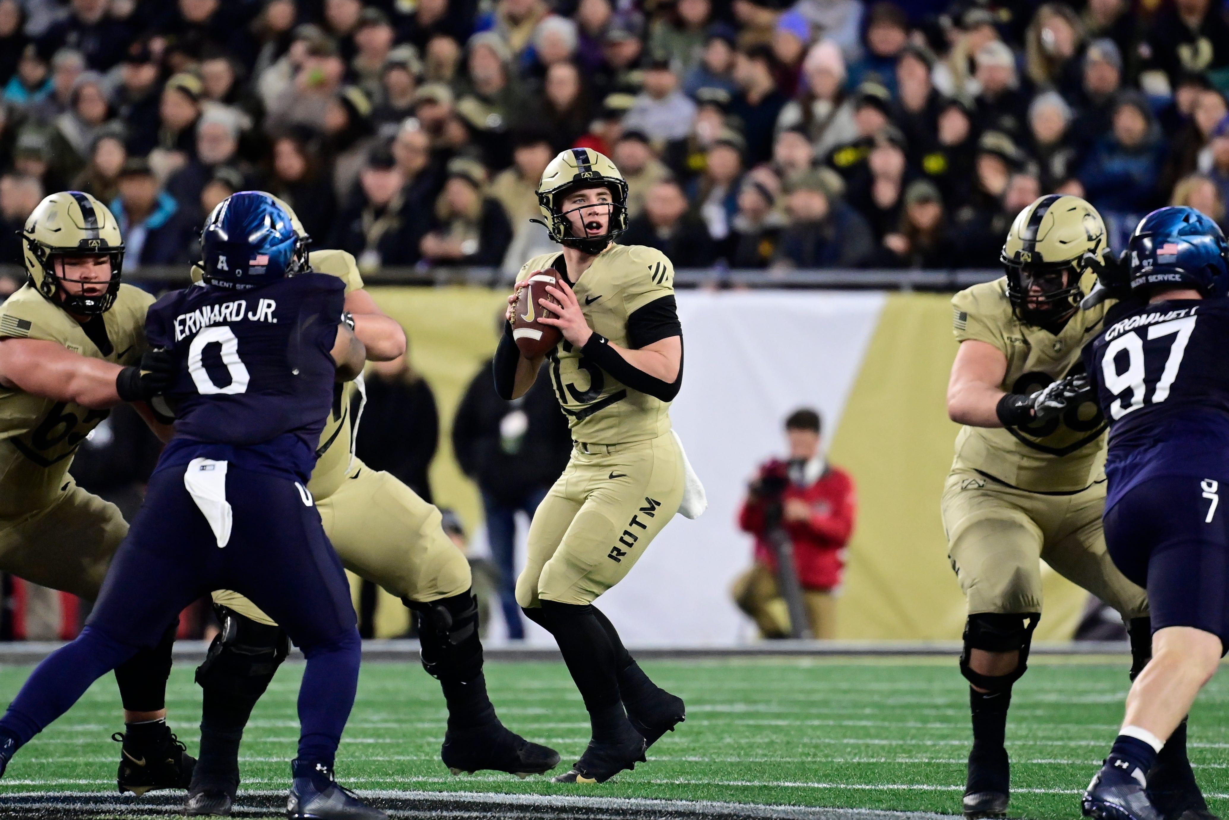 Army Black Knights quarterback Bryson Daily (13) looks to pass the ball during the first half against the Navy Midshipmen at Gillette Stadium in Foxborough, Massachusetts.