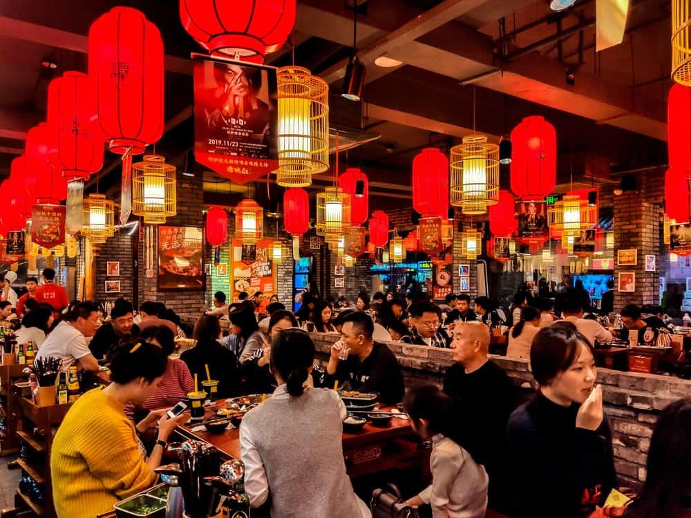 Bustling Sichuan Hotpot Restaurant with red Lanterns