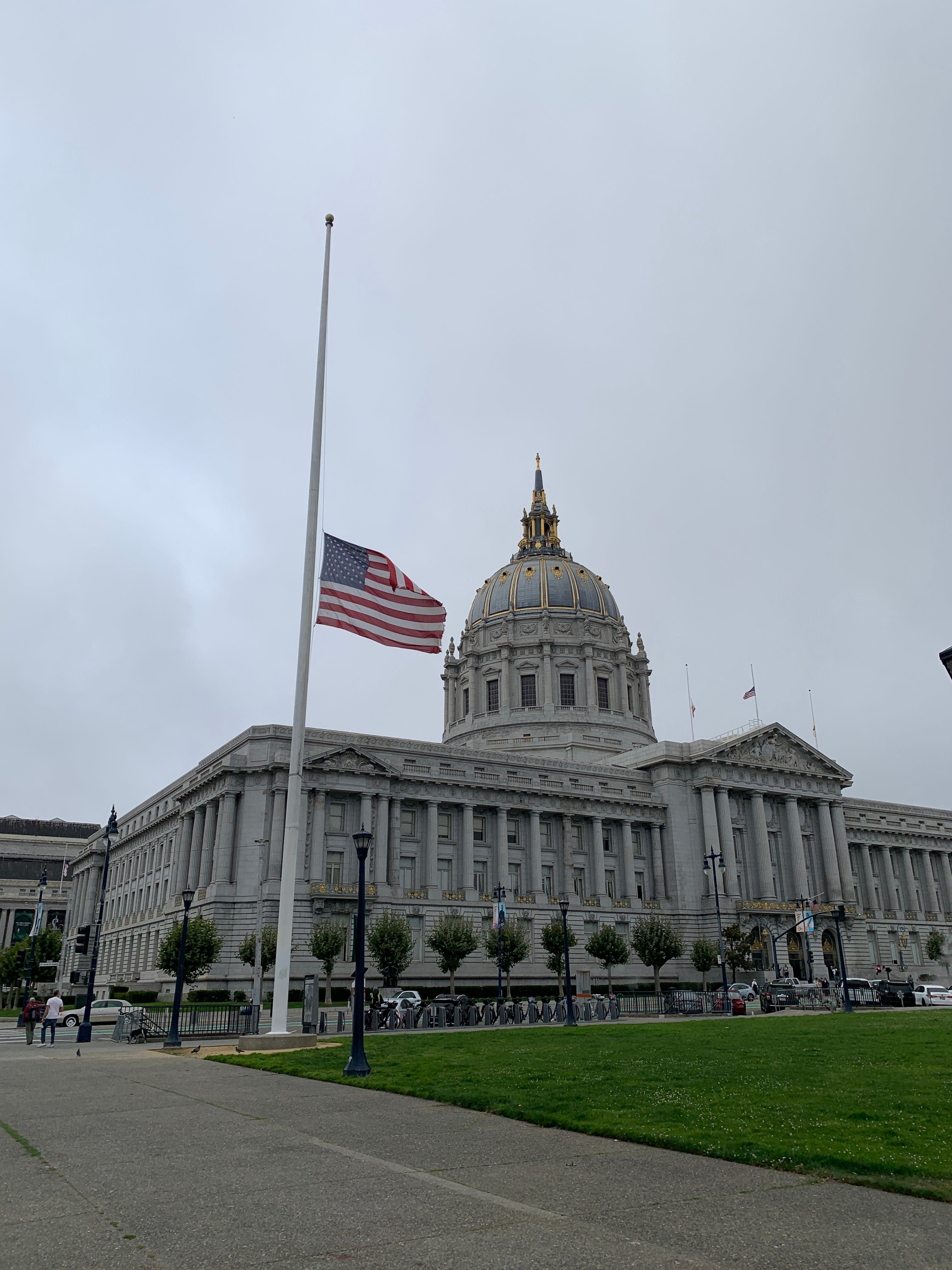 An American flag flies at half-staff in front of San Francisco City Hall on Friday, September 29, 2023, to honor Senator Dianne Feinstein. Feinstein, who served on San Francisco