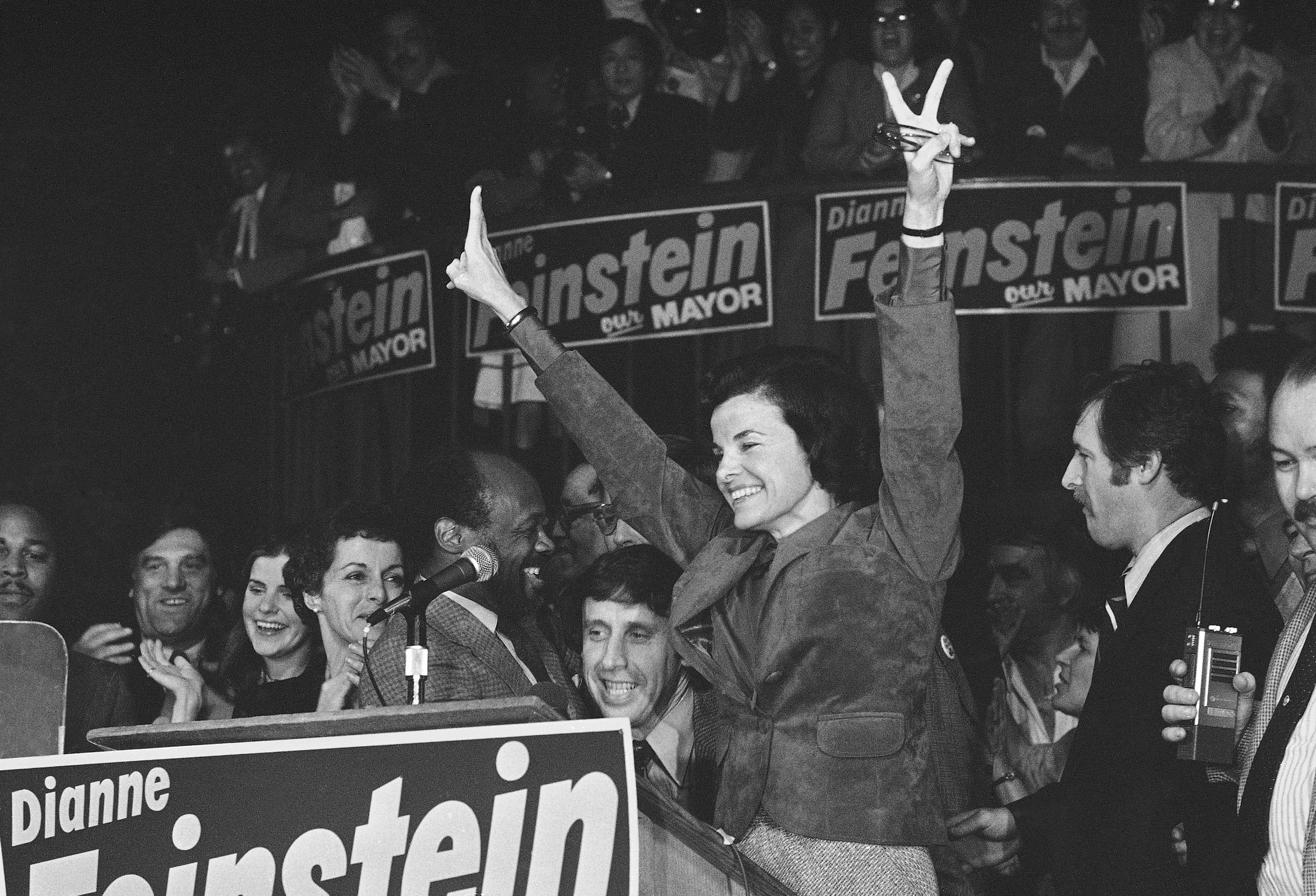 FILE - San Francisco Mayor Dianne Feinstein, named mayor following the assassination of late Mayor George Moscone, in San Francisco, Dec. 12, 1979. With her on the victory platform are, from left, Moscone