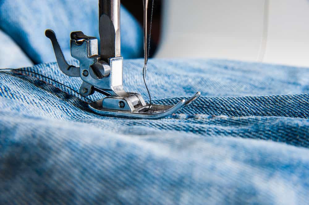 Sewing machine and blue jeans fabric