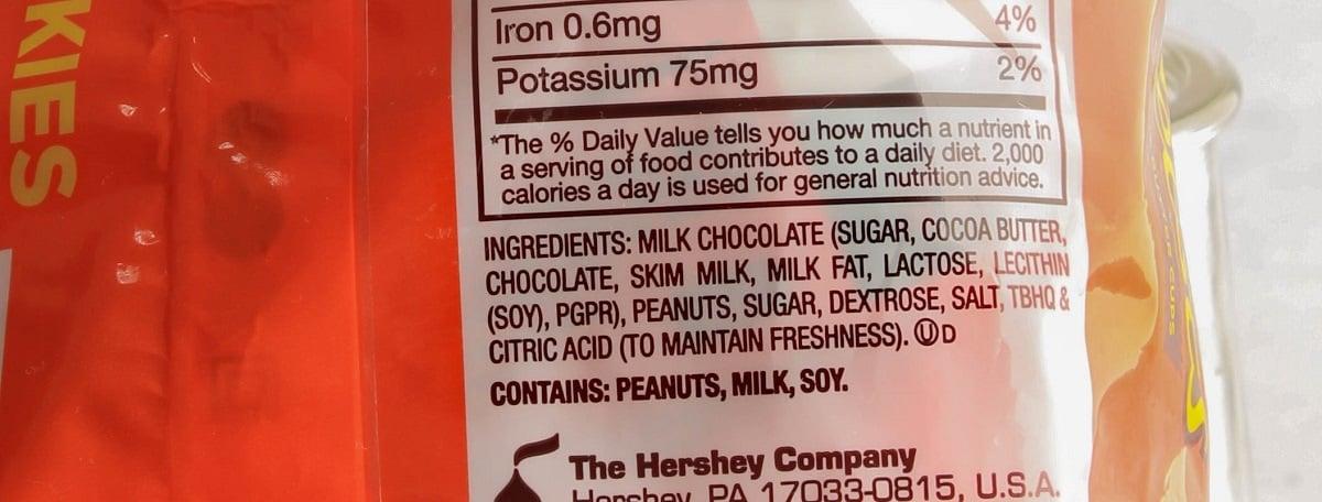 Up close look at the list of ingredients and the allergy label on a bag of Reese