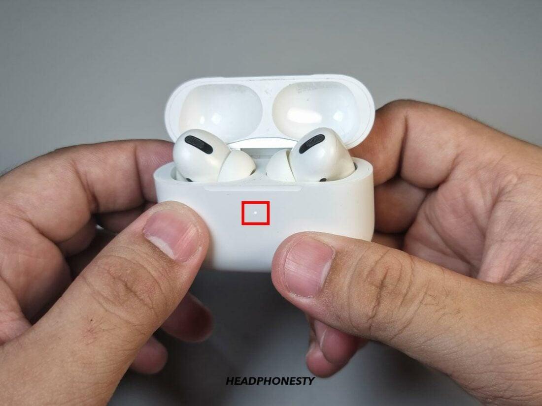 AirPods case light flashes white.