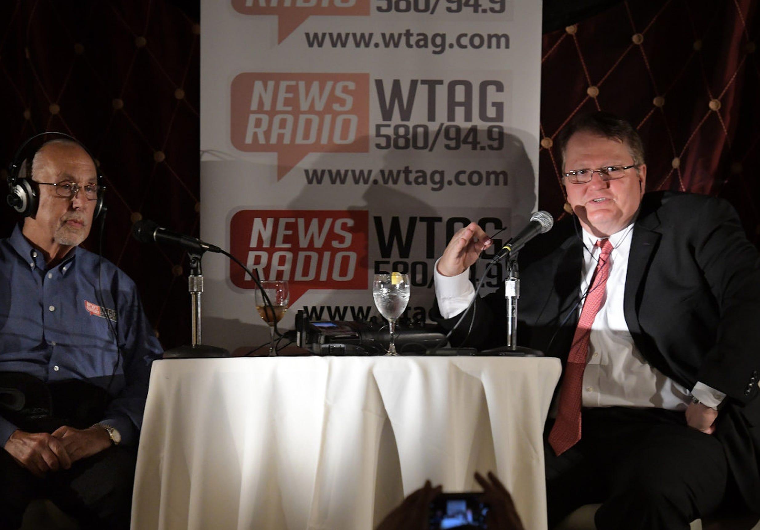Jordan Levy and Jim Polito broadcast live on WTAG radio during a televised political debate between Donald J. Trump and Hillary Clinton shown on a big screen at Luciano
