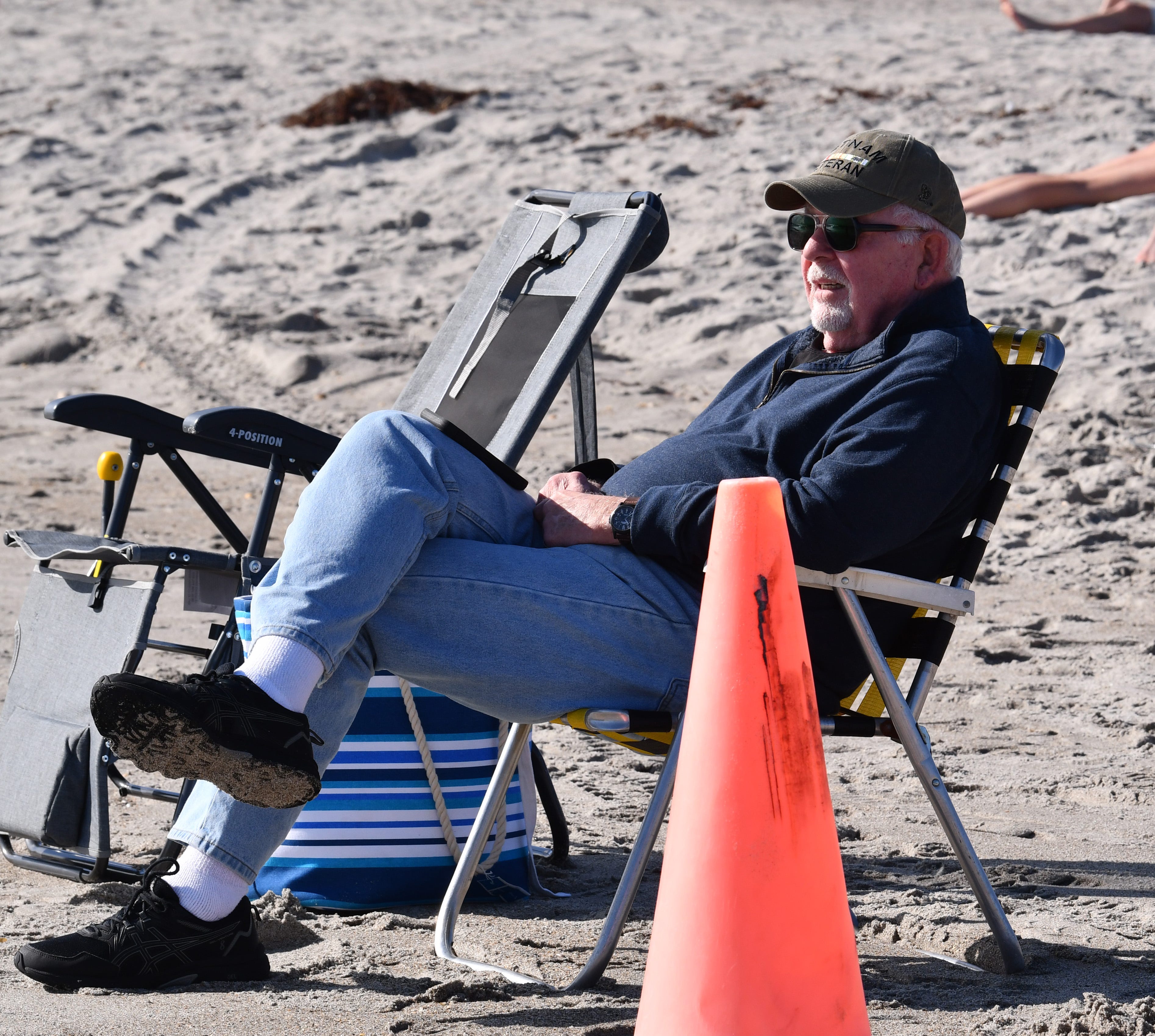 Dave Opperman and his wife are from Iowa. Dave was sitting near the lifeguard stand at the Westgate Cocoa Beach Pier enjoying the weather. While it was a little chilly, he noted it was 20 degrees back in Iowa.