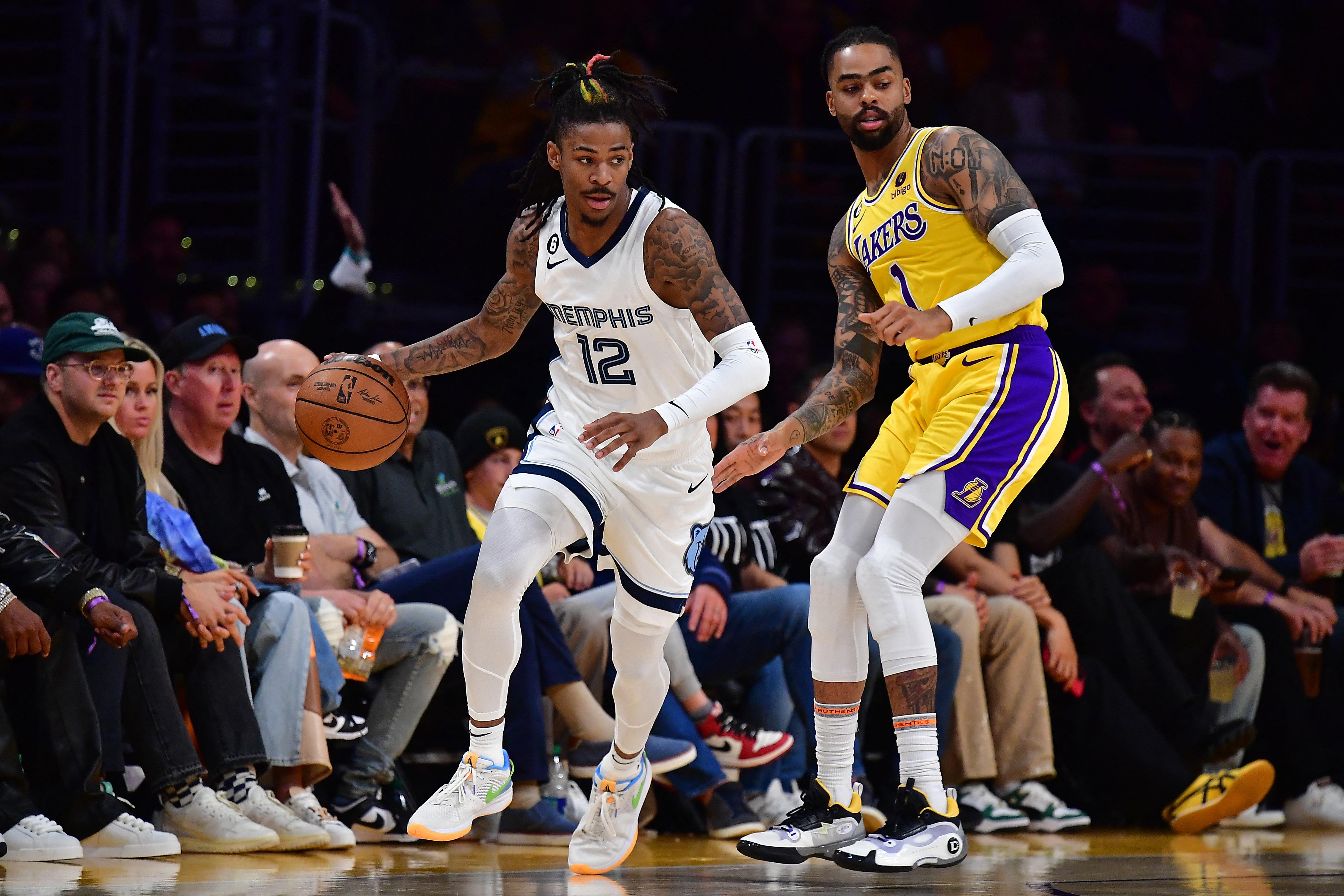 Ja morant dribbles the ball.