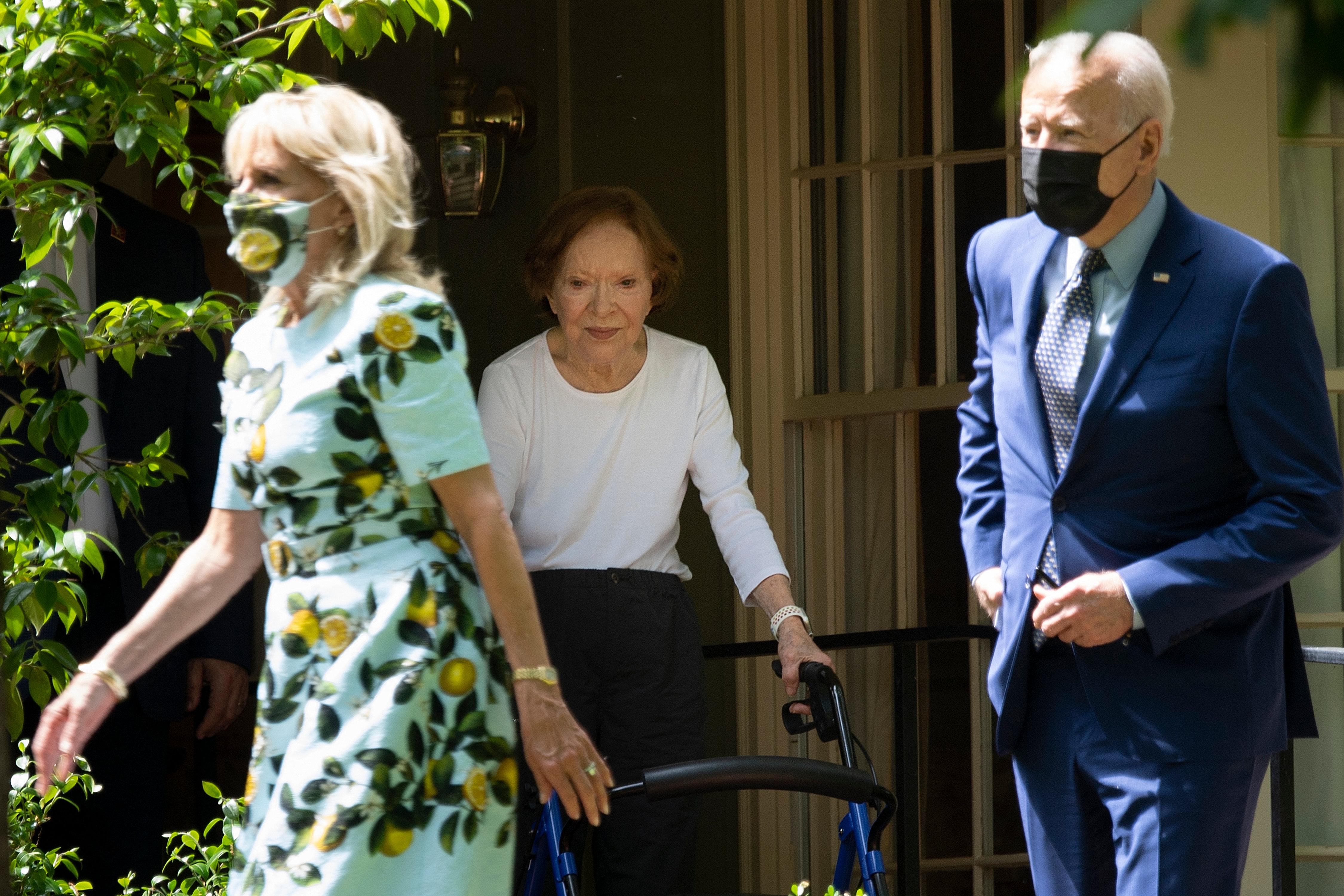 Former First Lady Rosalynn Carter (C) walks US President Joe Biden and US first lady Dr. Jill Biden out after they after visited former US President Jimmy Carter, April 29, 2021, in Plains, Georgia. (Photo by Brendan Smialowski / AFP) (Photo by BRENDAN SMIALOWSKI/AFP via Getty Images)