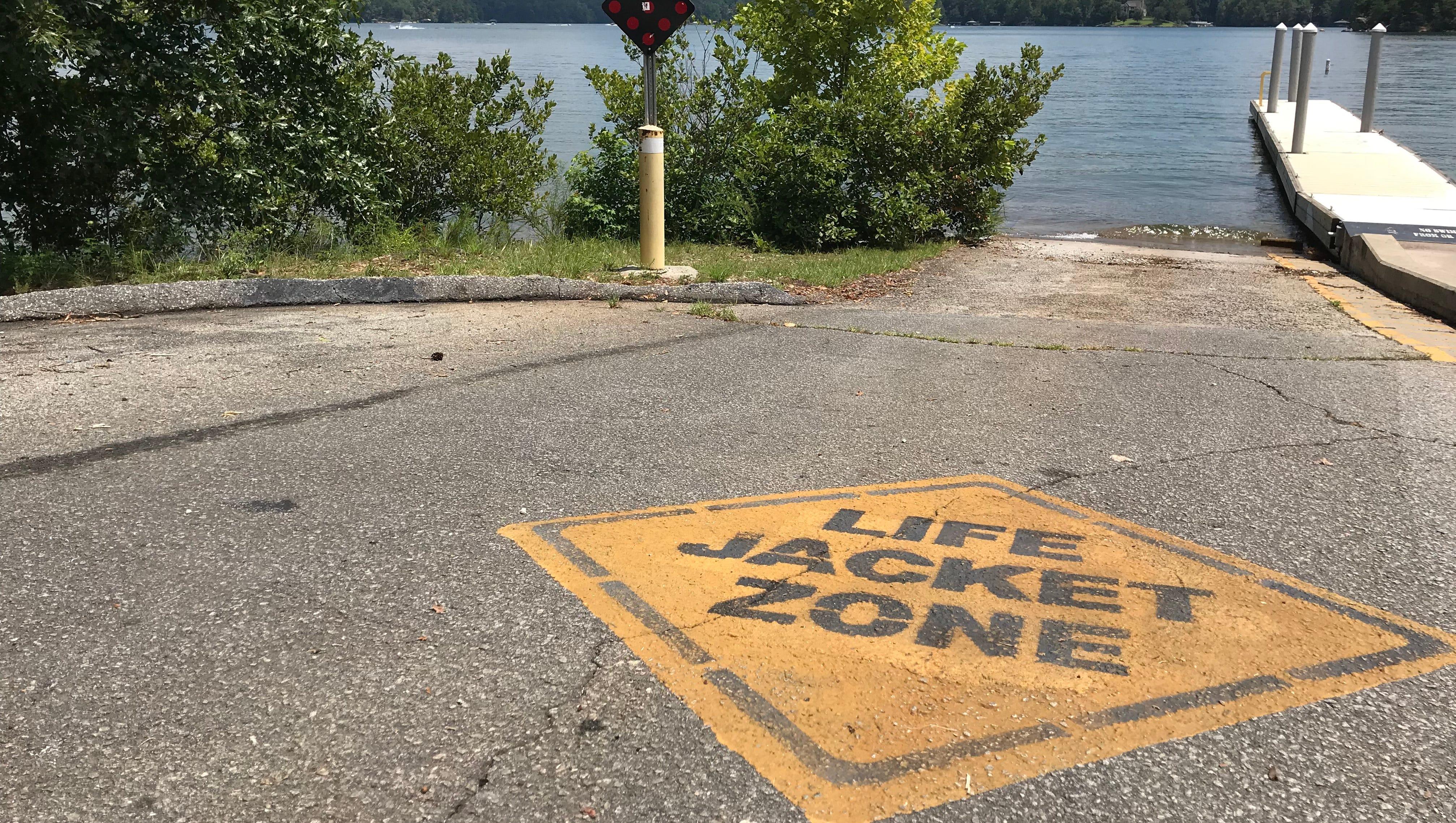Signs are displayed in various areas of Lake Keowee that urge lake-goers to wear life jackets.