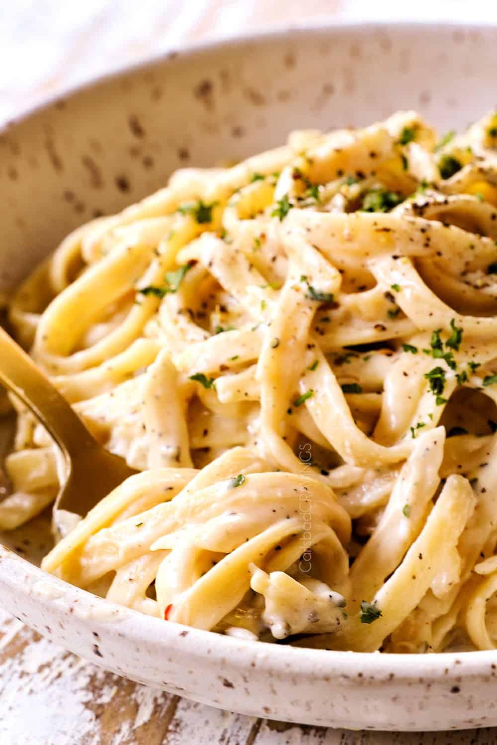 a fork full of easy homemade fettuccine Alfredo