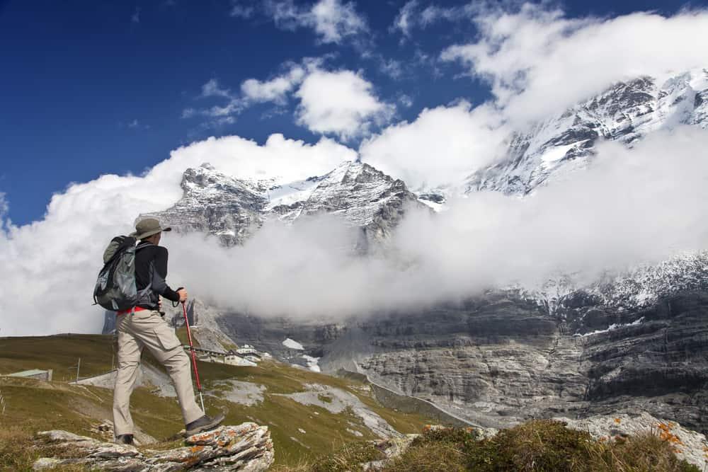 Hiker in the mountains in front of the Eiger