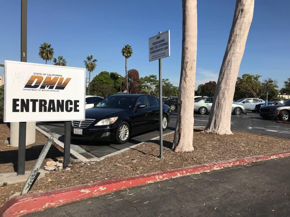 The DMV Entrance sign at the parking lot
