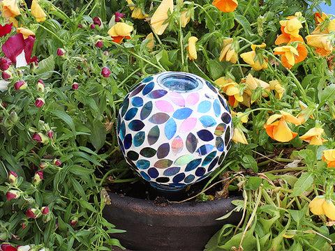 blue mosaic glass watering globe in flowers