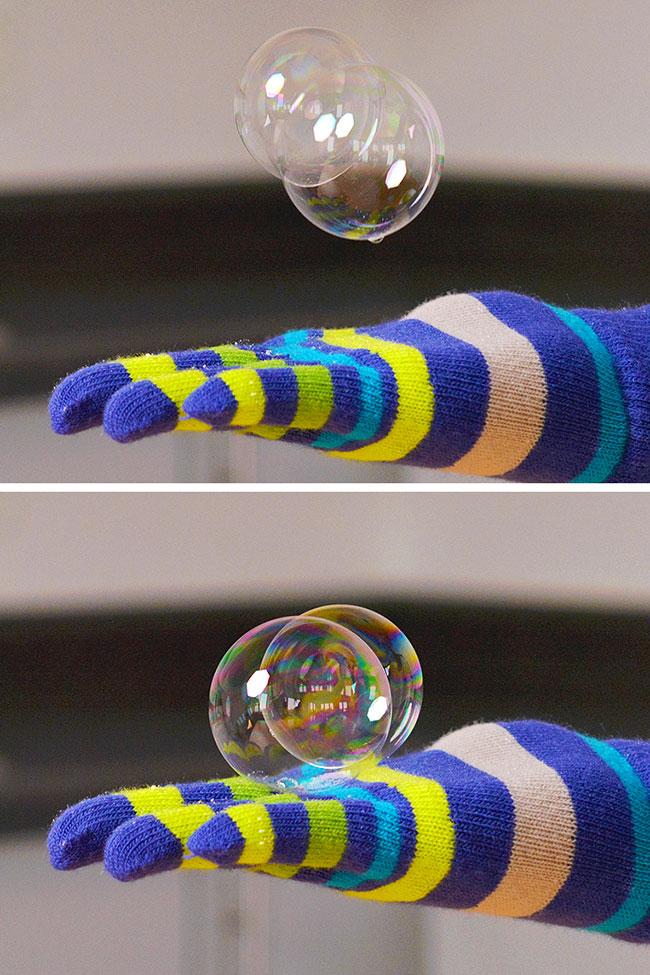 Bubble bouncing on a gloved hand